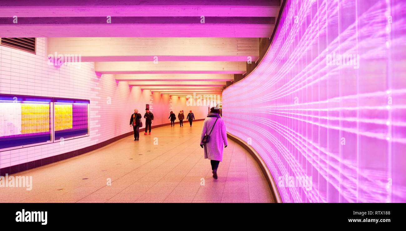 Pink glowing wall in the passage in the basement of the main station, Essen, Ruhr area, North Rhine-Westphalia, Germany Stock Photo