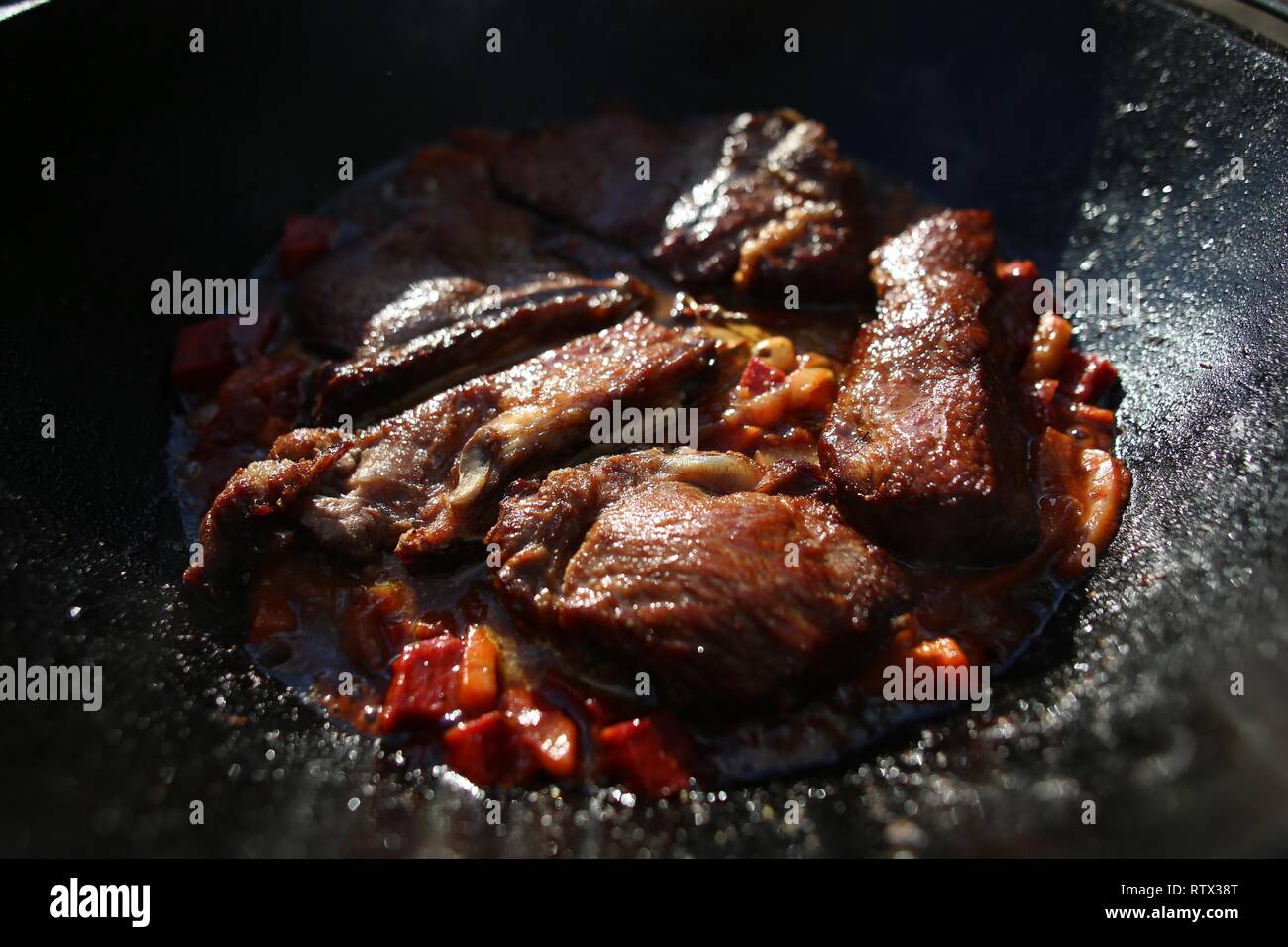 barbecue, roast beef, on a fire in a special pan, stew in nature Stock