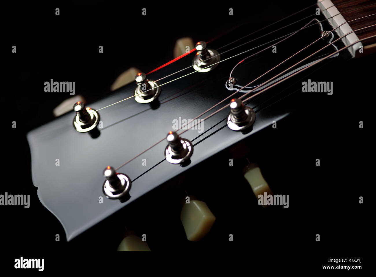 Headstock and machine head tuners of a new Gibson Les Paul Traditional electric guitar Stock Photo