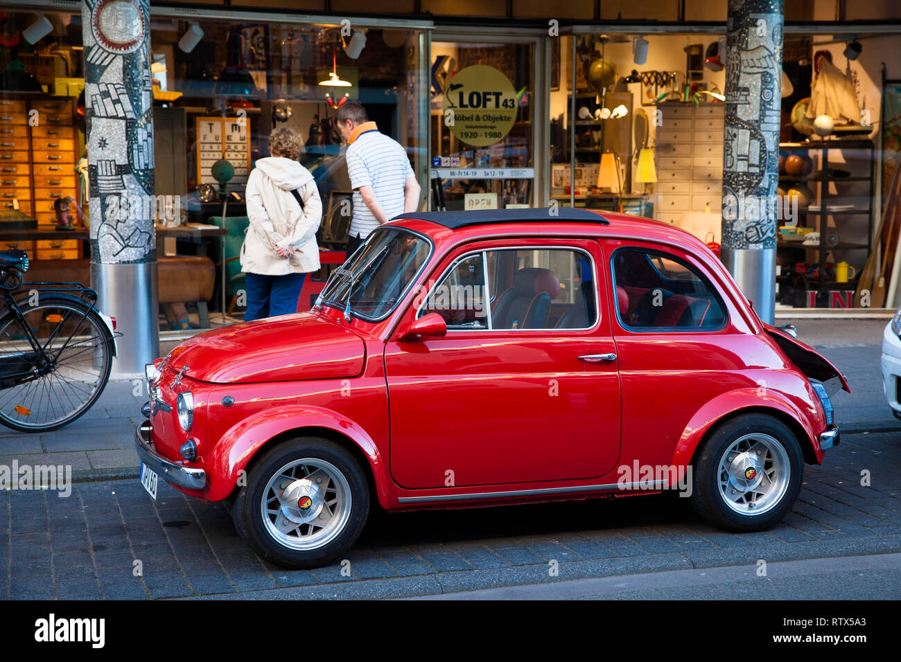 old Fiat Nuova 500 Abarth in front of a shop on Marzellenstreet, Cologne, Germany.  alter Fiat Nuova 500 Abarth vor einem Geschaeft in der Marzellenst Stock Photo