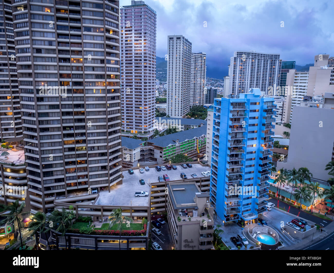 Waikiki skyline in the evening with clouds rolling in over the mountains. Stock Photo