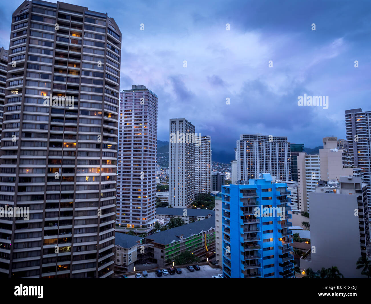 Waikiki skyline in the evening with clouds rolling in over the mountains. Stock Photo