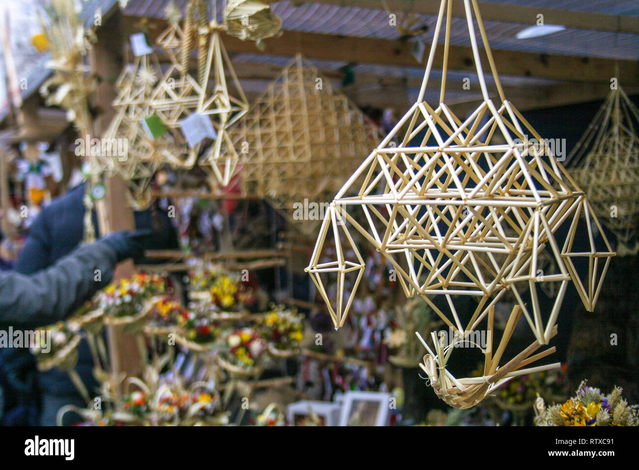 Sodas, beautiful Lithuanian traditional craft, straw decoration, market in Vilnius, Lithuania Stock Photo