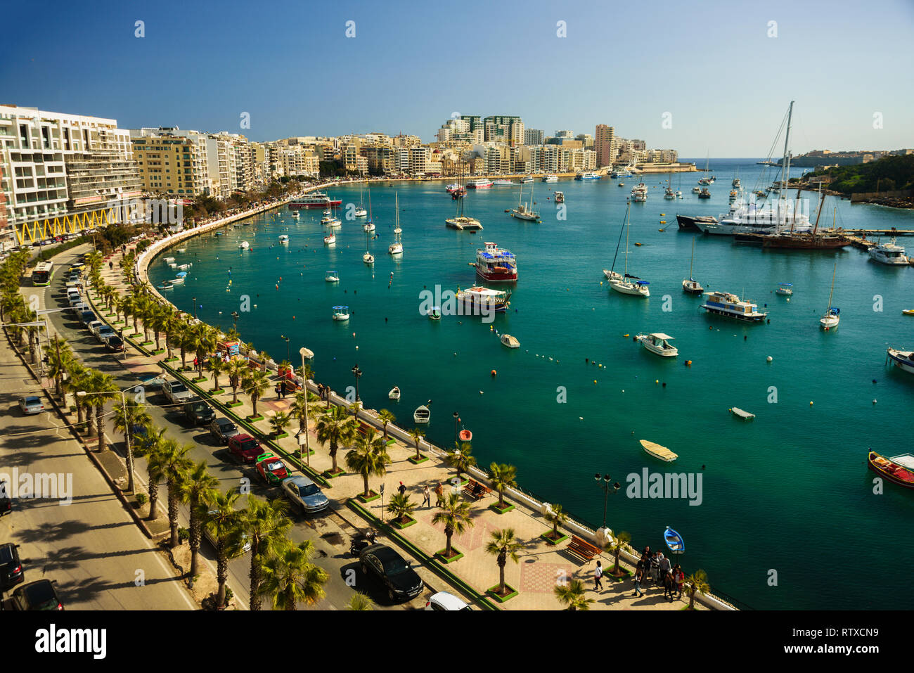 Aerial view to Sliema promenade, Malta. Harbour with a lot of traditional boats luzzu. Sunny day Stock Photo