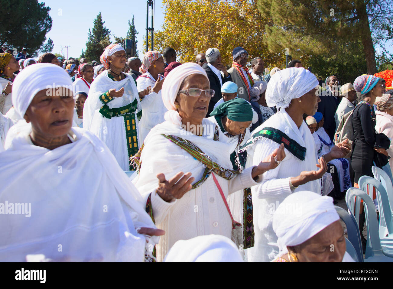 JERUSALEM - NOV 20, 2014: Ethiopian Jewish women pray at the Sigd, in Jerusalem, Israel. The Sigd is an annual holiday of the Ethiopian Jews Stock Photo