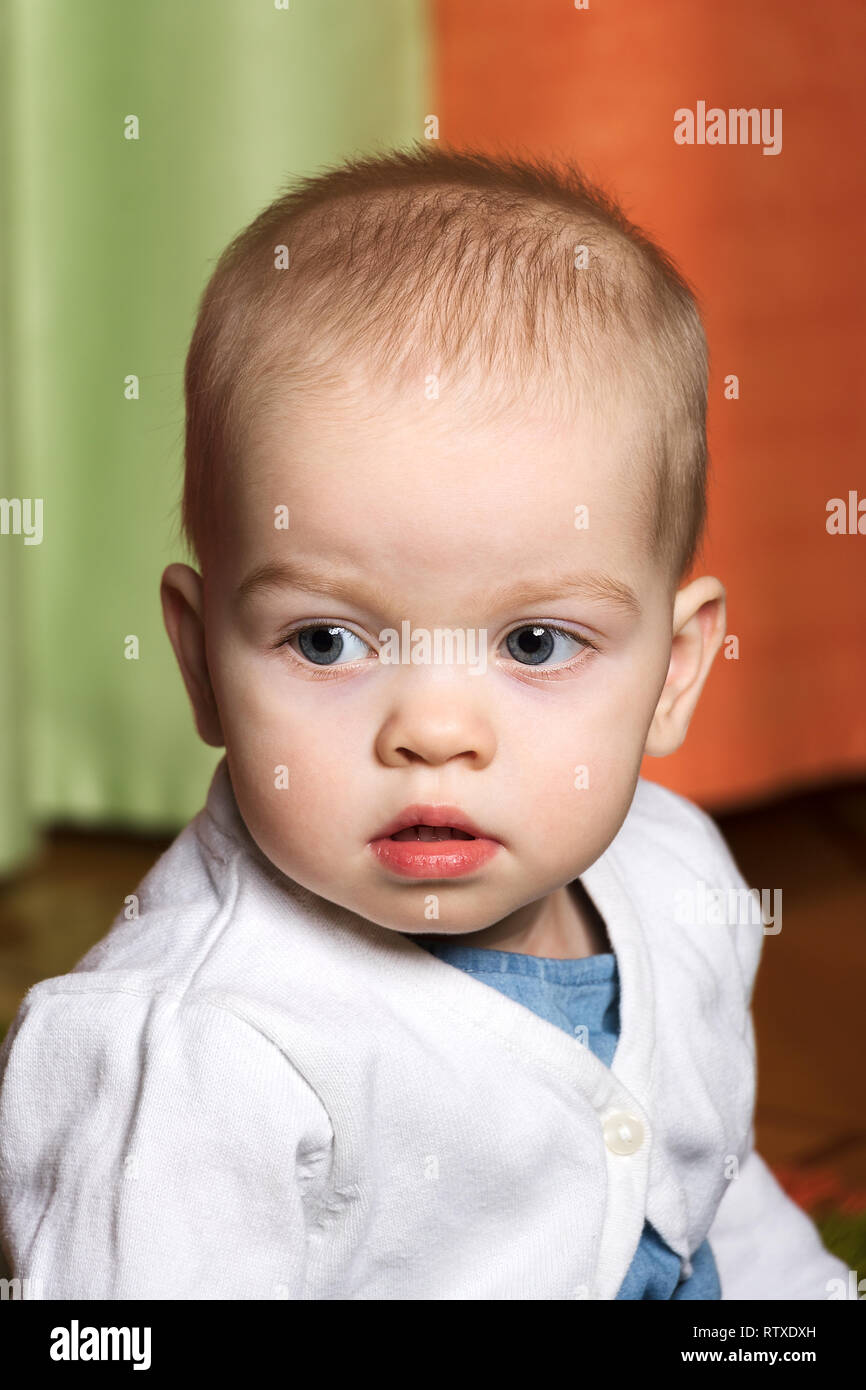 portrait of a nice little girl in a white sweater Stock Photo