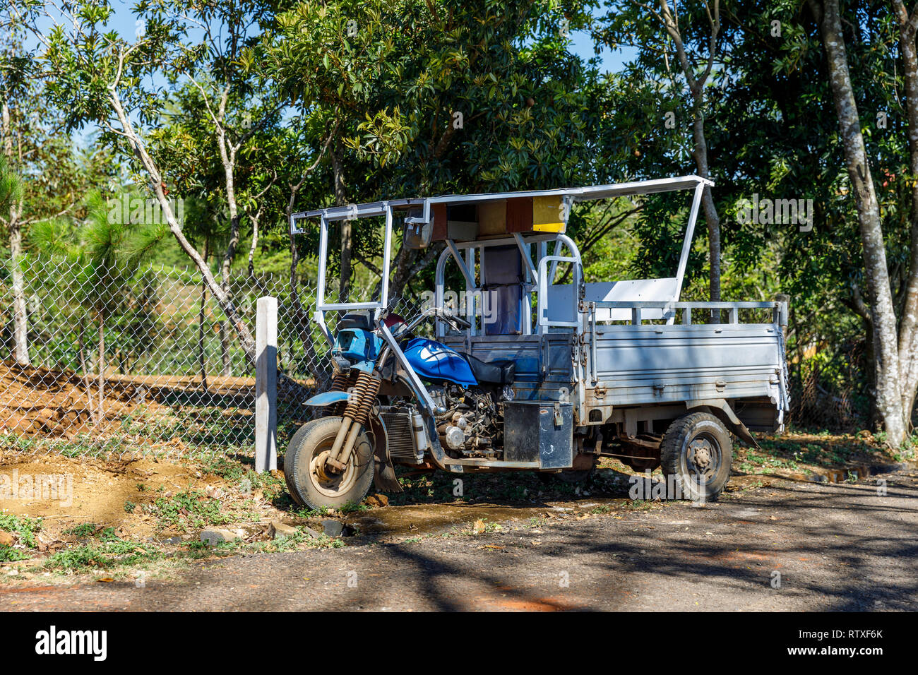 DAM BRI, VIETNAM - FEBRUARY 19, 2018: Custom made blue three wheel vehicle in Dam Bri, Vietnam Stock Photo