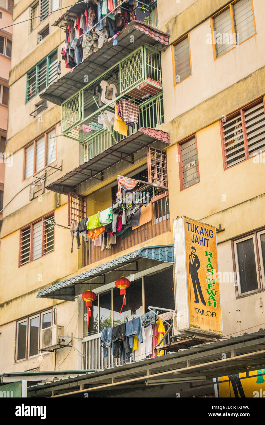 view looking up on typical block of apartments with laundry Kuala