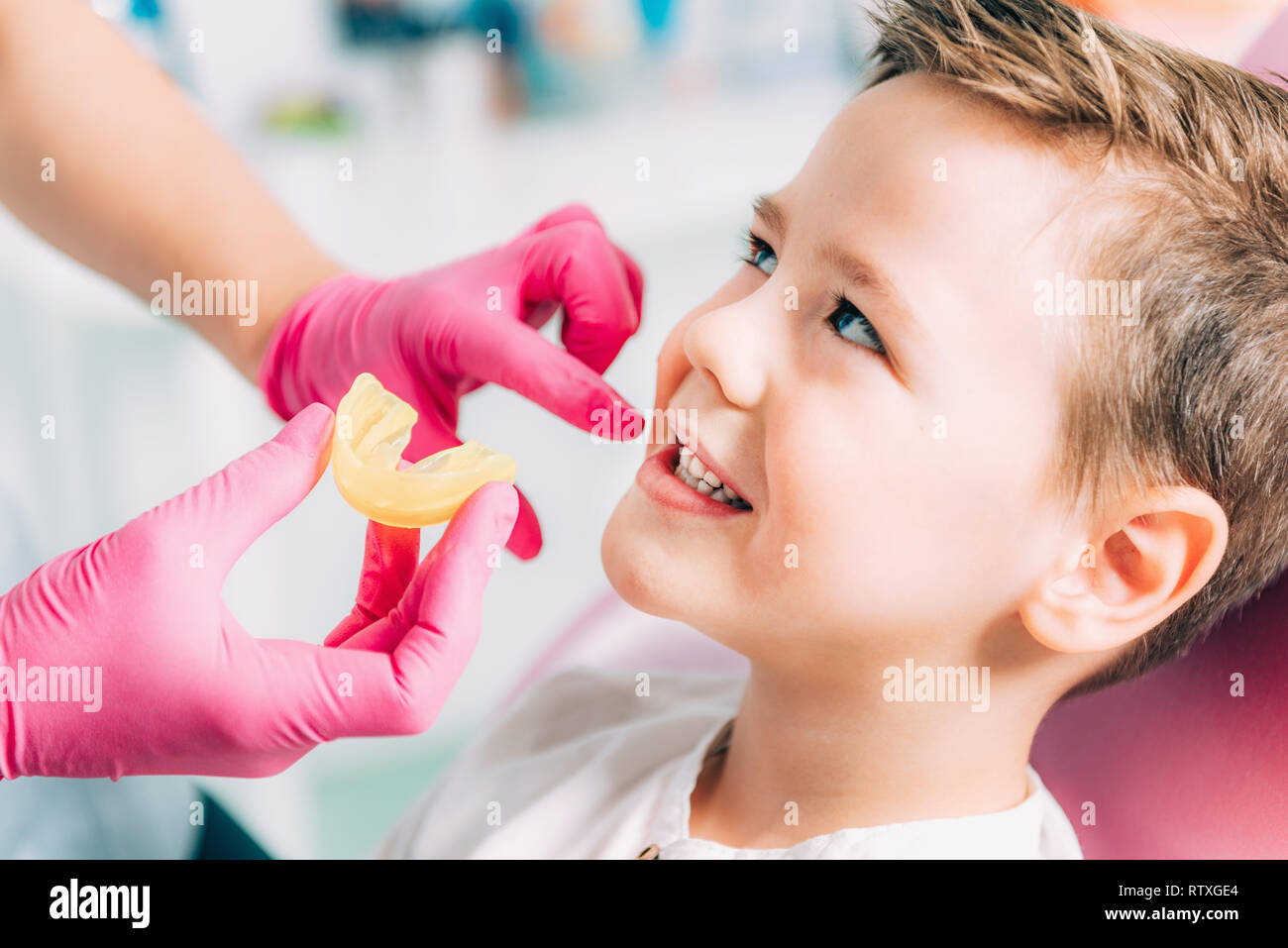 Orthodontist working with little boy. Stock Photo
