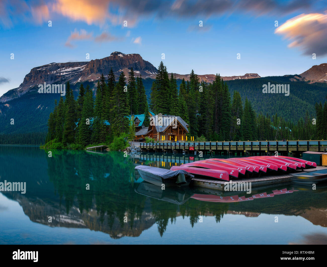 Canoes on beautiful Emerald Lake in Yoho National Park, Canada Stock Photo