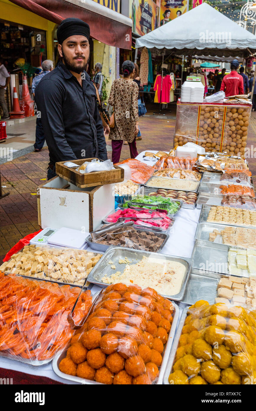 Sidewalk Vendor of Candy, Pastries, and Sweets, Brickfields, Little India, Kuala Lumpur, Malaysia. Stock Photo