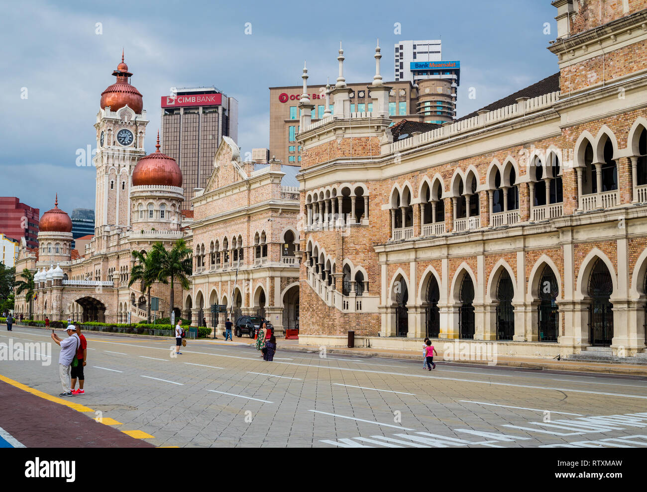 Colonial Moorish Architecture, Raja Street.  Catholic Church in center, Sultan Abdul Samad Building in distance. Kuala Lumpur, Malaysia. Stock Photo