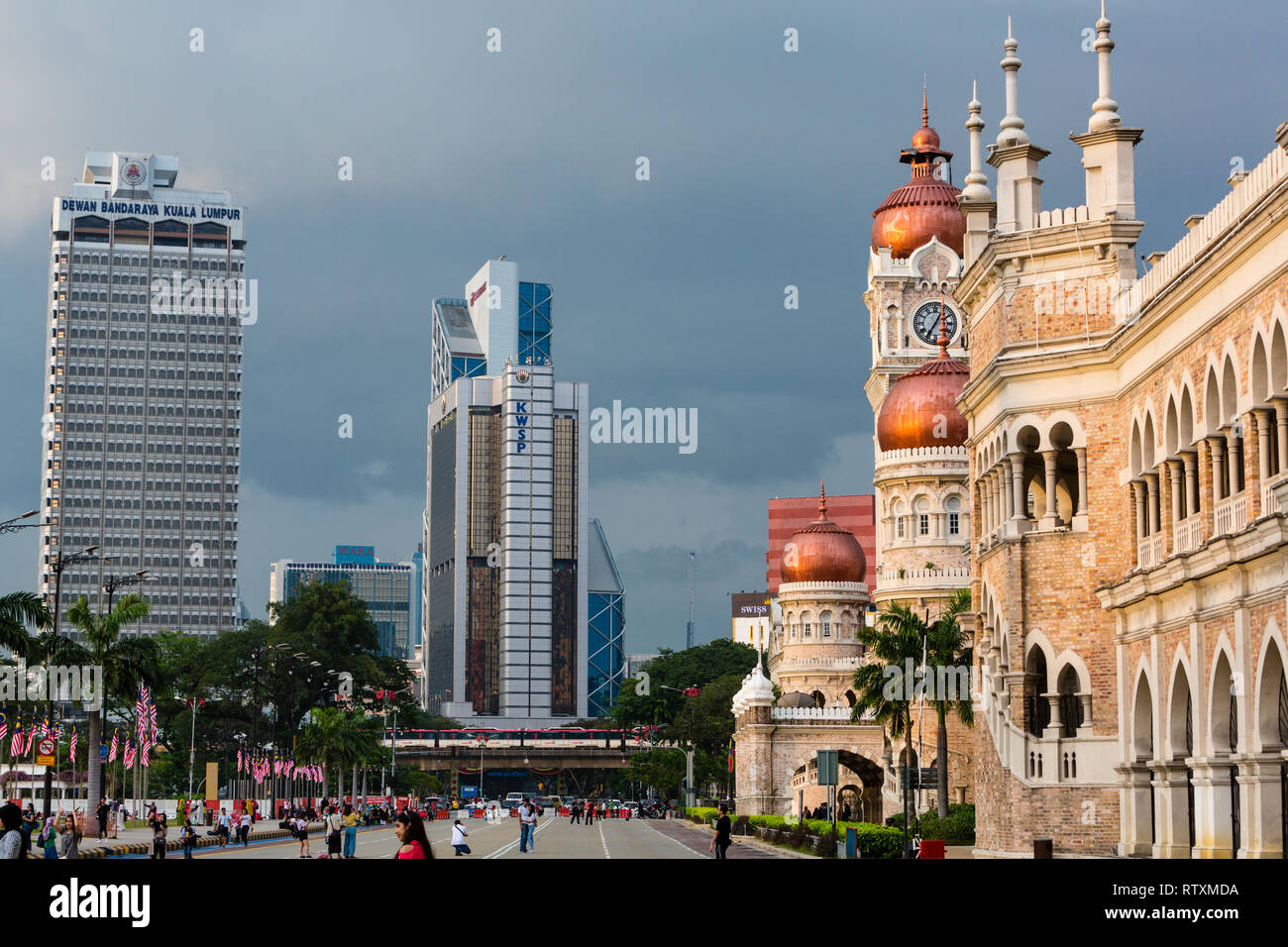 Juxtaposition of Modern Highrise Office Buildings with British Colonial Era Moorish Architecture.  Sultan Abdul Samad Building on right, former seat o Stock Photo