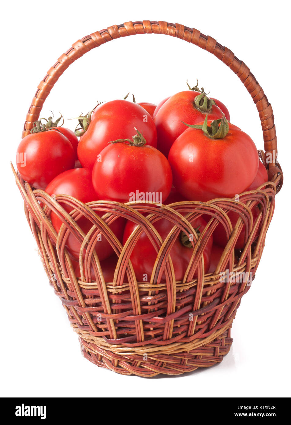red tomatoes in a wicker basket isolated on white background Stock ...