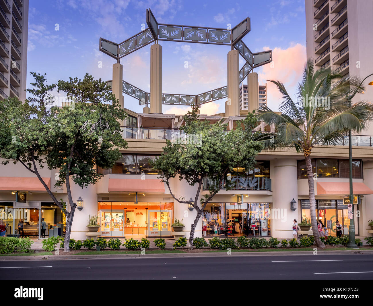 Retail outlets on Kalakaua Avenue on April 27, 2014 in Waikiki, Hawaii. Kalakaua Avenue is the favorite luxury shopping strip for tourists visiting Ha Stock Photo