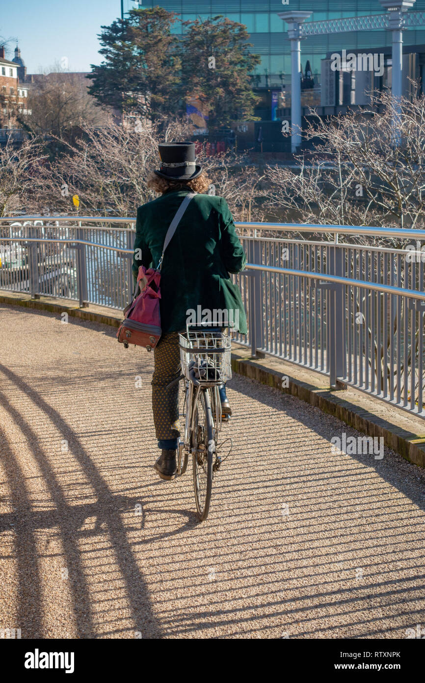 Eccentrically dressed man wearing a Top Hat and wearing a Green Velvet