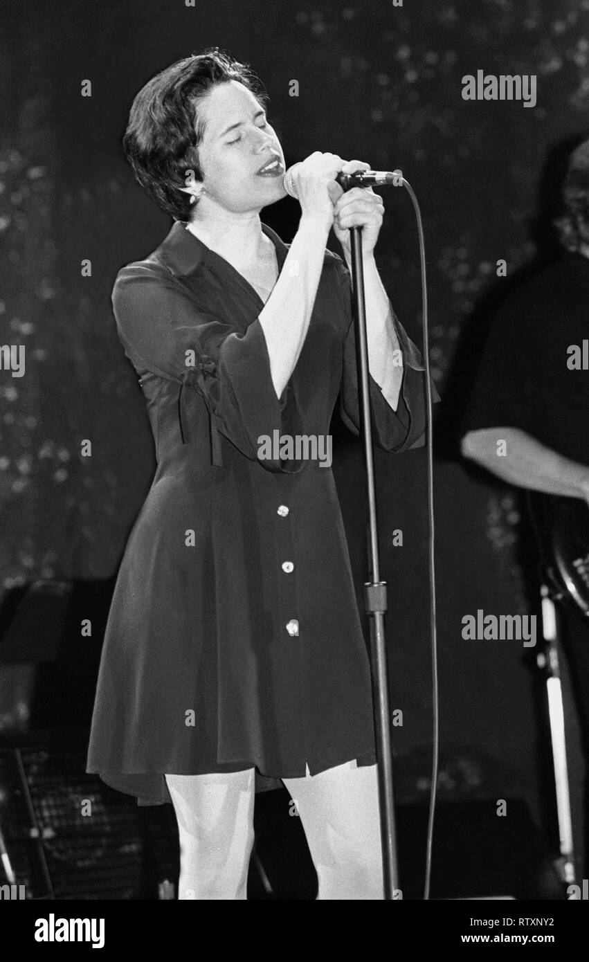 Singer Natalie Merchant is shown performing on stage during a 'live' concert appearance with the 10,000 Maniacs. Stock Photo