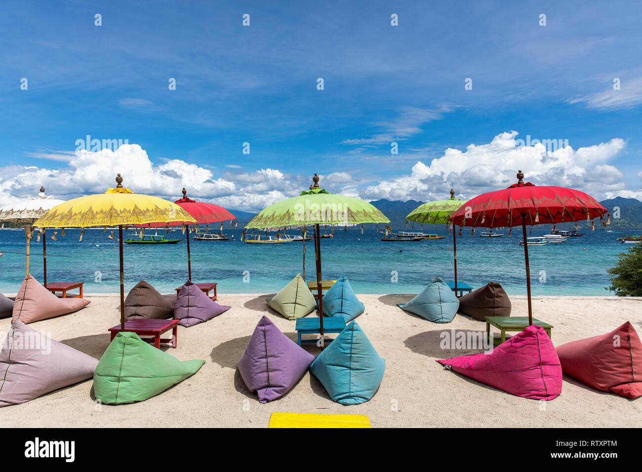 Colorful sunbeds on the beach of Gili Trawangan island, Indonesia. Stock Photo