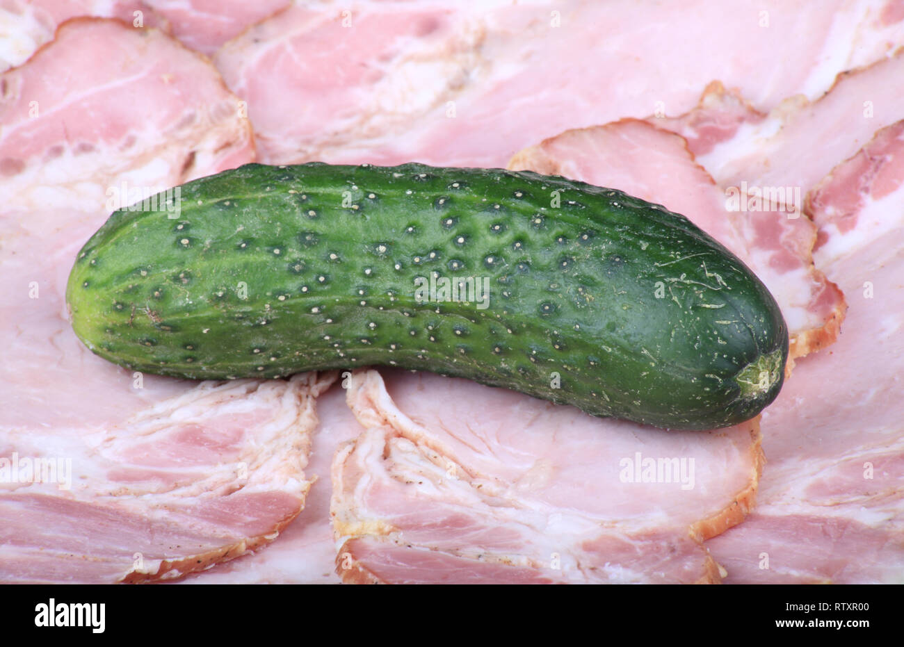 cucumber on ham meat Stock Photo Alamy