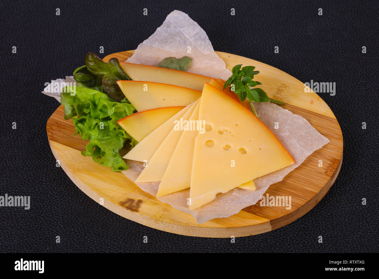 Sliced yellow Swiss cheese served salad leaves Stock Photo Alamy