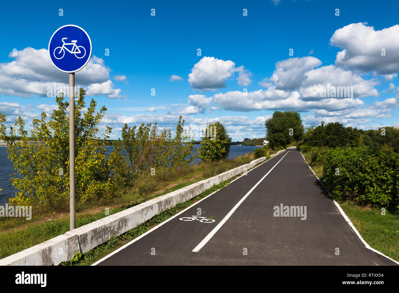 Bicycle road on a riverwalk along the Volga River in the city of Dubna, Moscow Oblast, Russia. Stock Photo