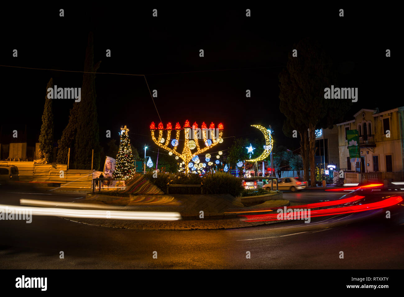 Haifa, Israel - December 1, 2018 : Three religions light ornaments in The German Colony decoration for the holidays, in Haifa, Israel Stock Photo
