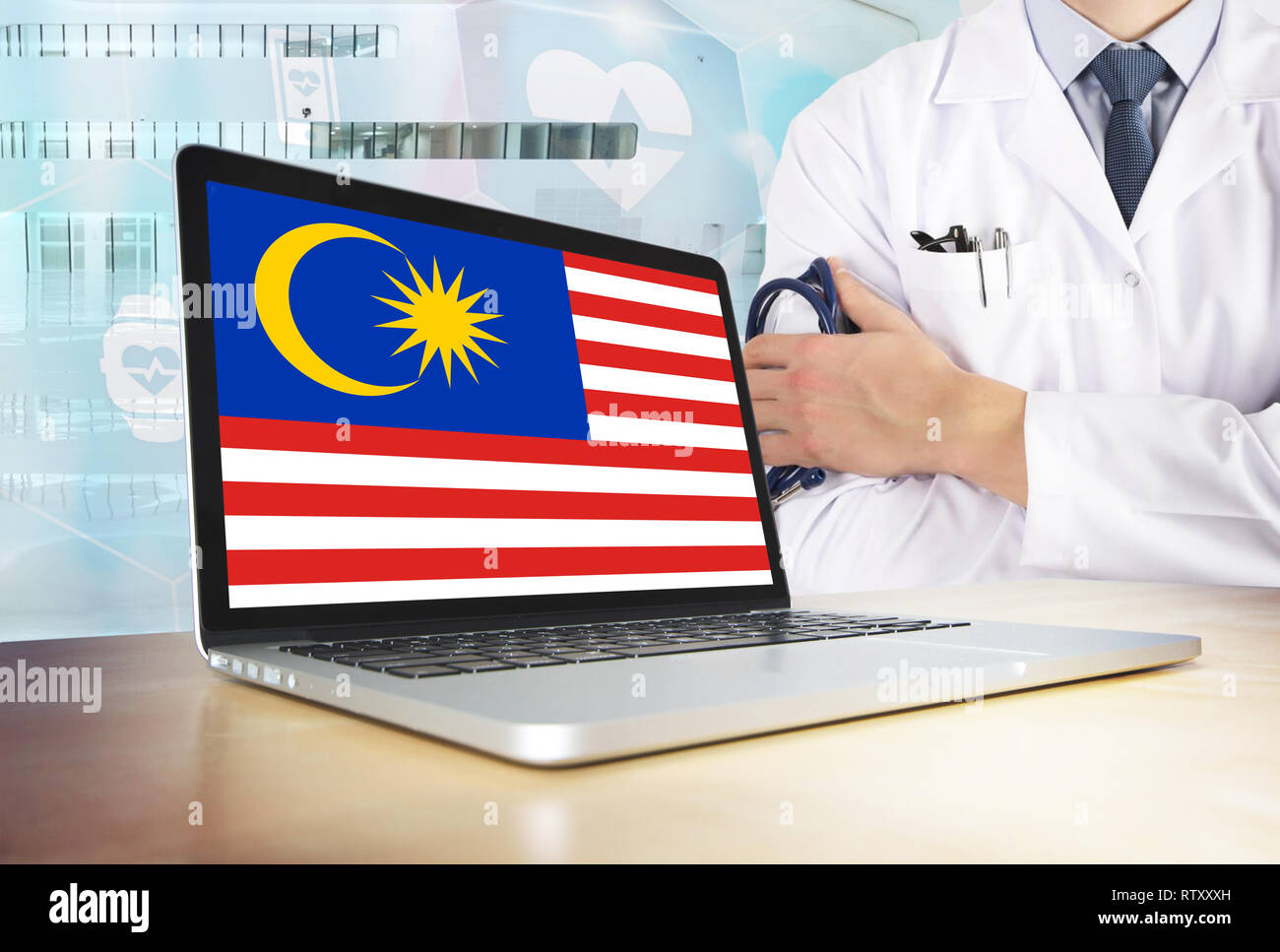 Malaysia Healthcare System In Tech Theme Malaysian Flag On Computer Screen Doctor Standing With Stethoscope In Hospital Cryptocurrency And Blockcha Stock Photo Alamy