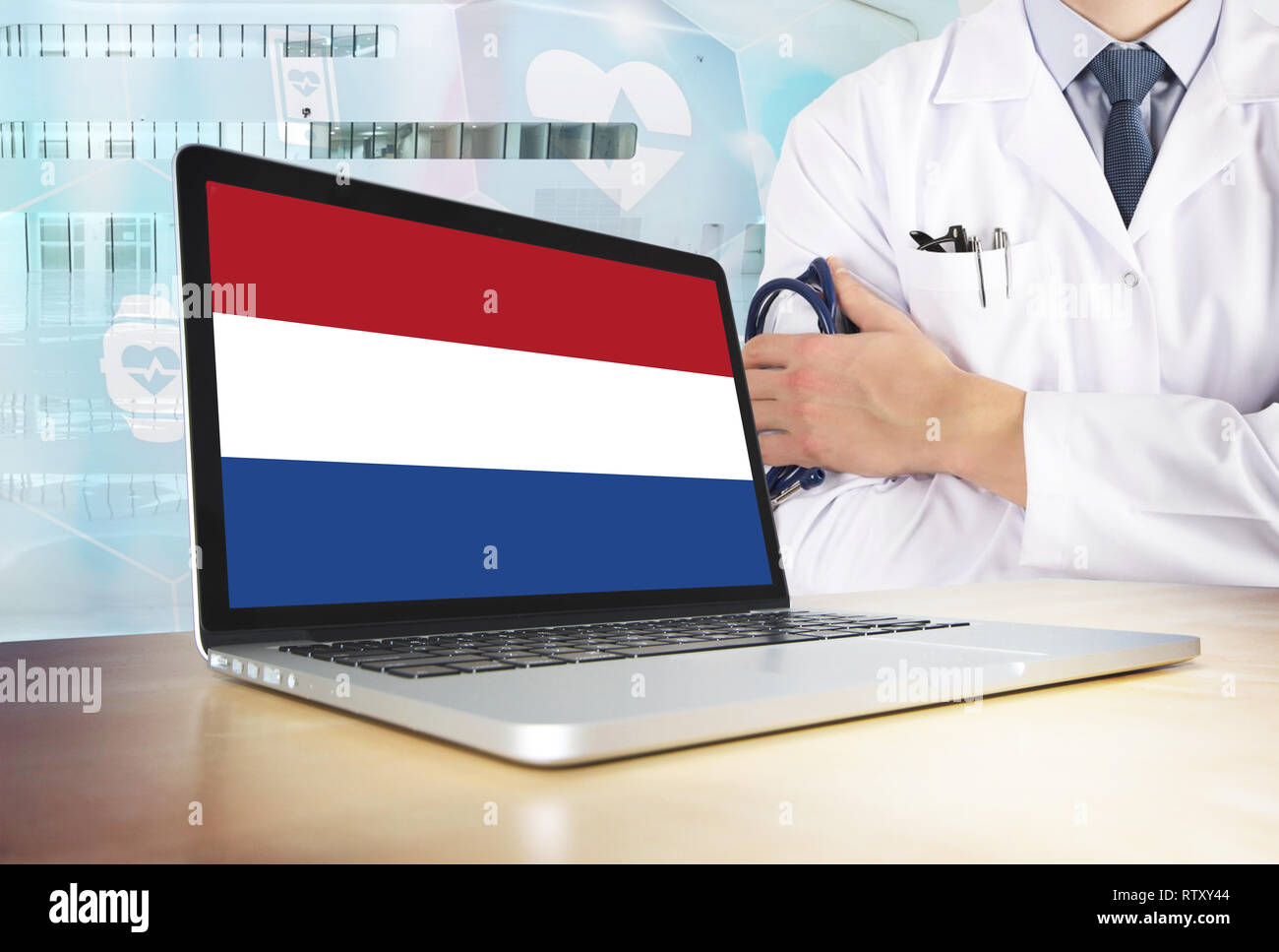 Netherlands healthcare system in tech theme. Dutch flag on computer