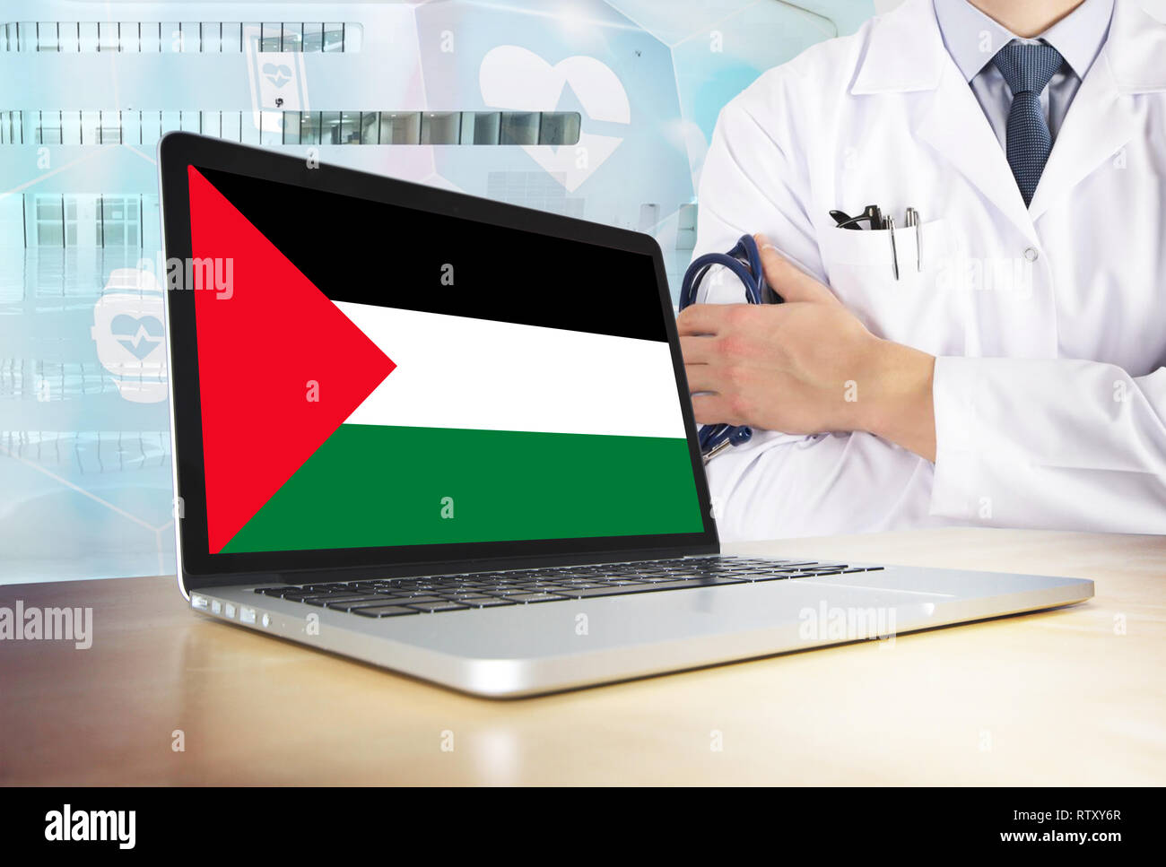 Palestine healthcare system in tech theme. Palestinian flag on computer