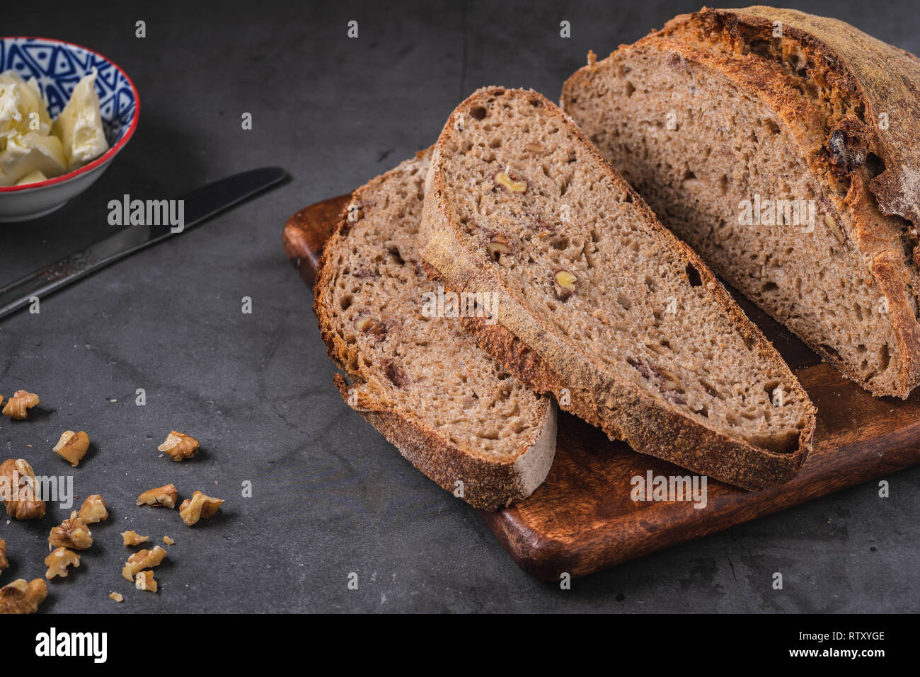 Artisan fresh sourdough bread on wooden table background Stock Photo