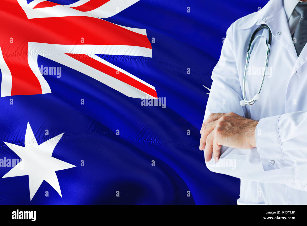 Australian Doctor standing with stethoscope on Australia flag background.  National healthcare system concept, medical theme Stock Photo - Alamy