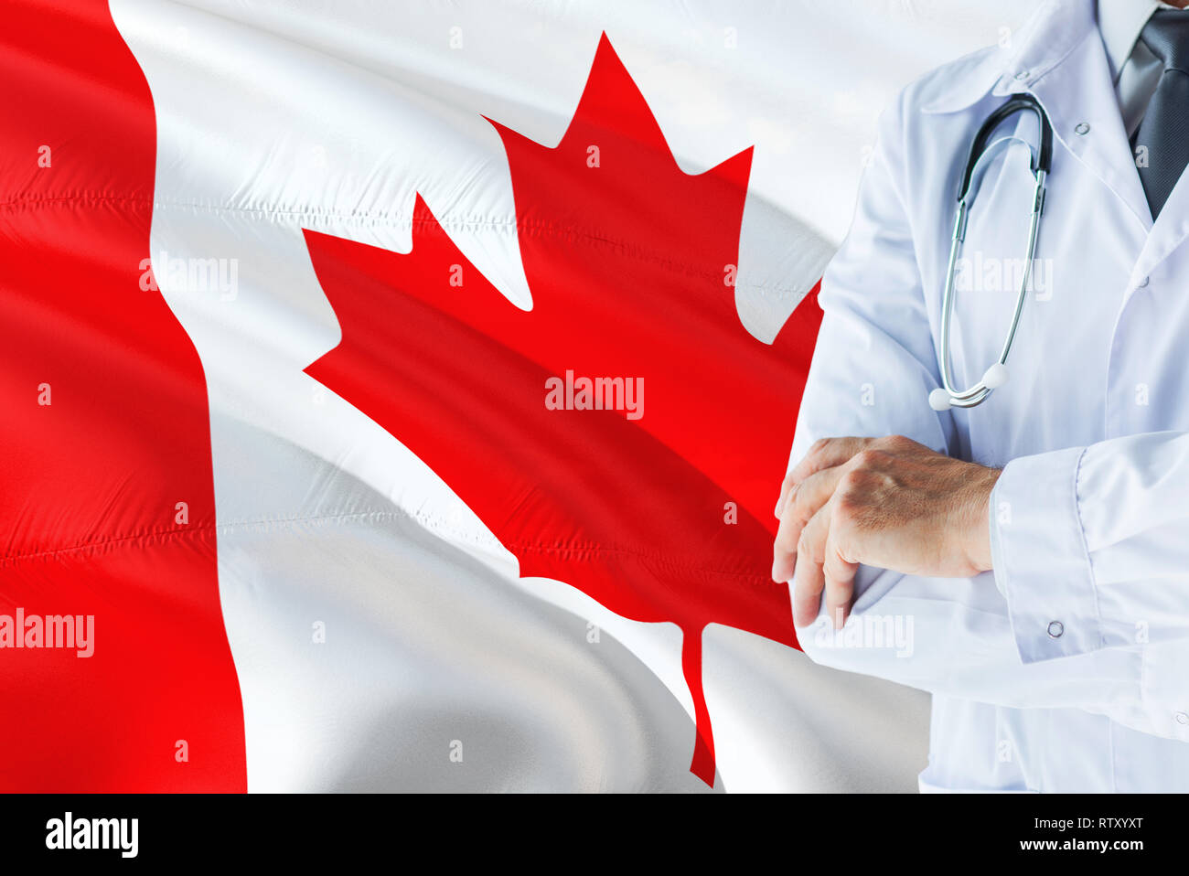 Canadian Doctor standing with stethoscope on Canada flag background