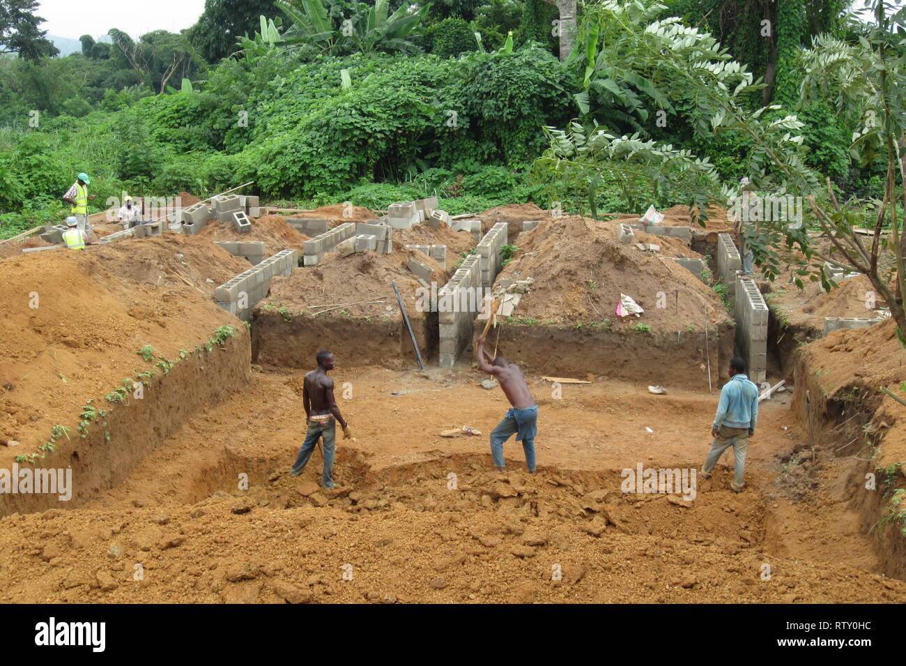 Nigerian workers making a manual excavation in the construction site of a building Stock Photo