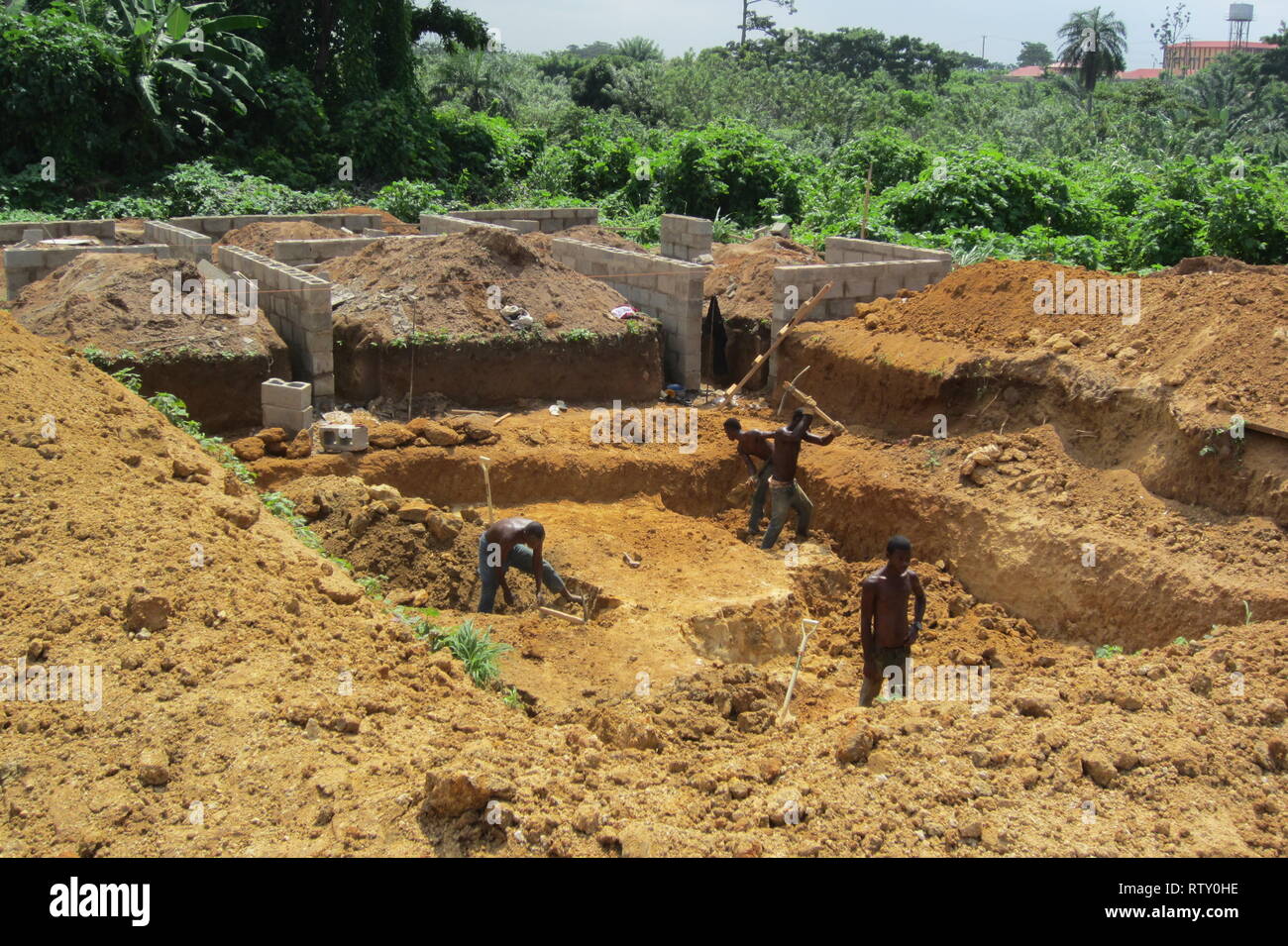Nigerian workers making a manual excavation in the construction site of a building Stock Photo