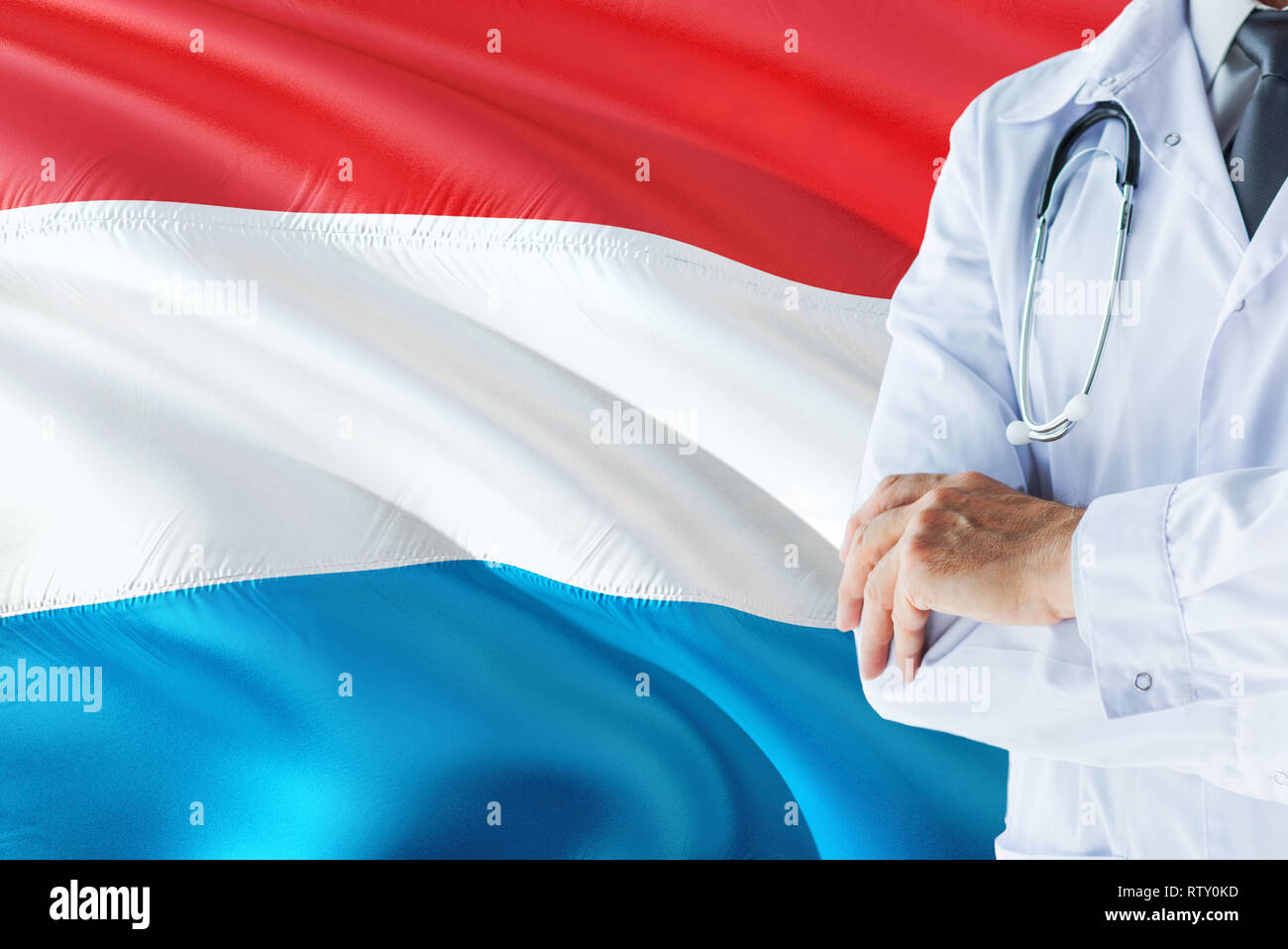 Luxembourger Doctor standing with stethoscope on Luxembourg flag
