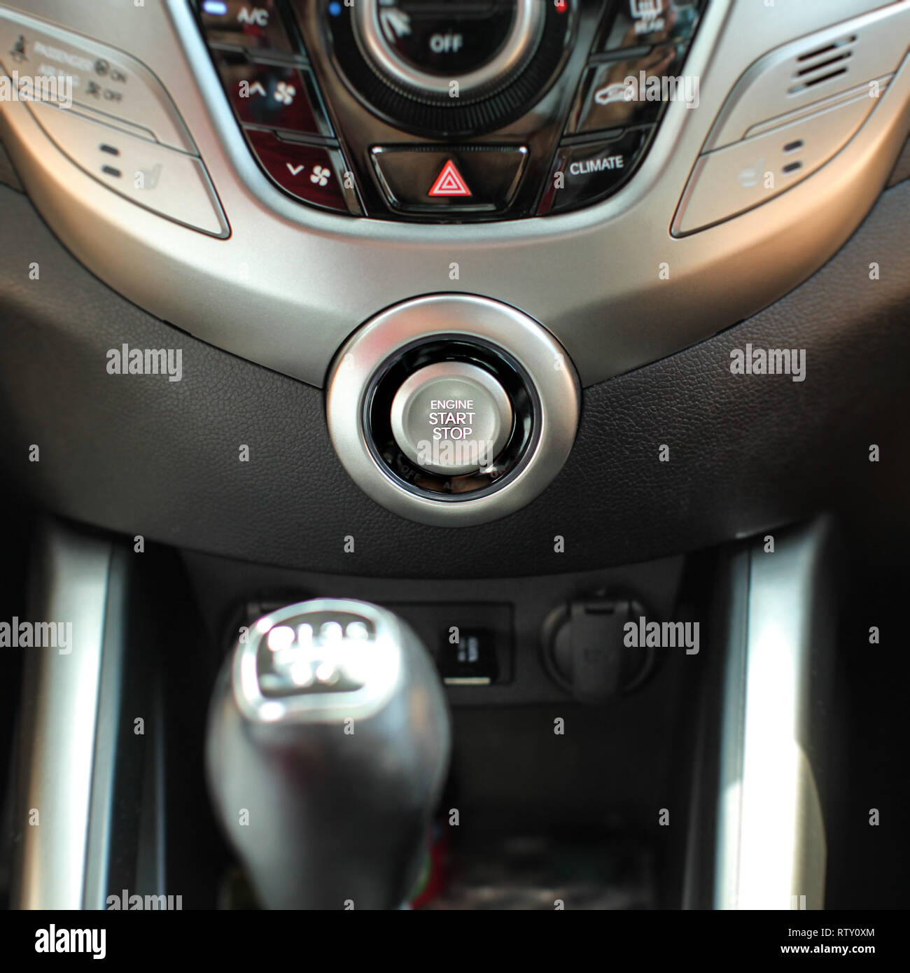 Modern car interior with engine start stop button in focus. Stock Photo