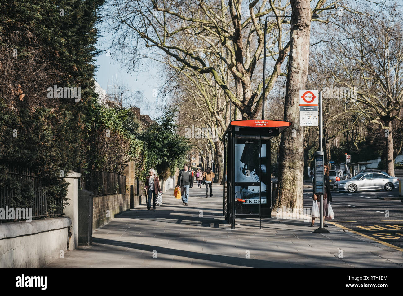 Bus stop uk london woman waiting hi-res stock photography and images ...