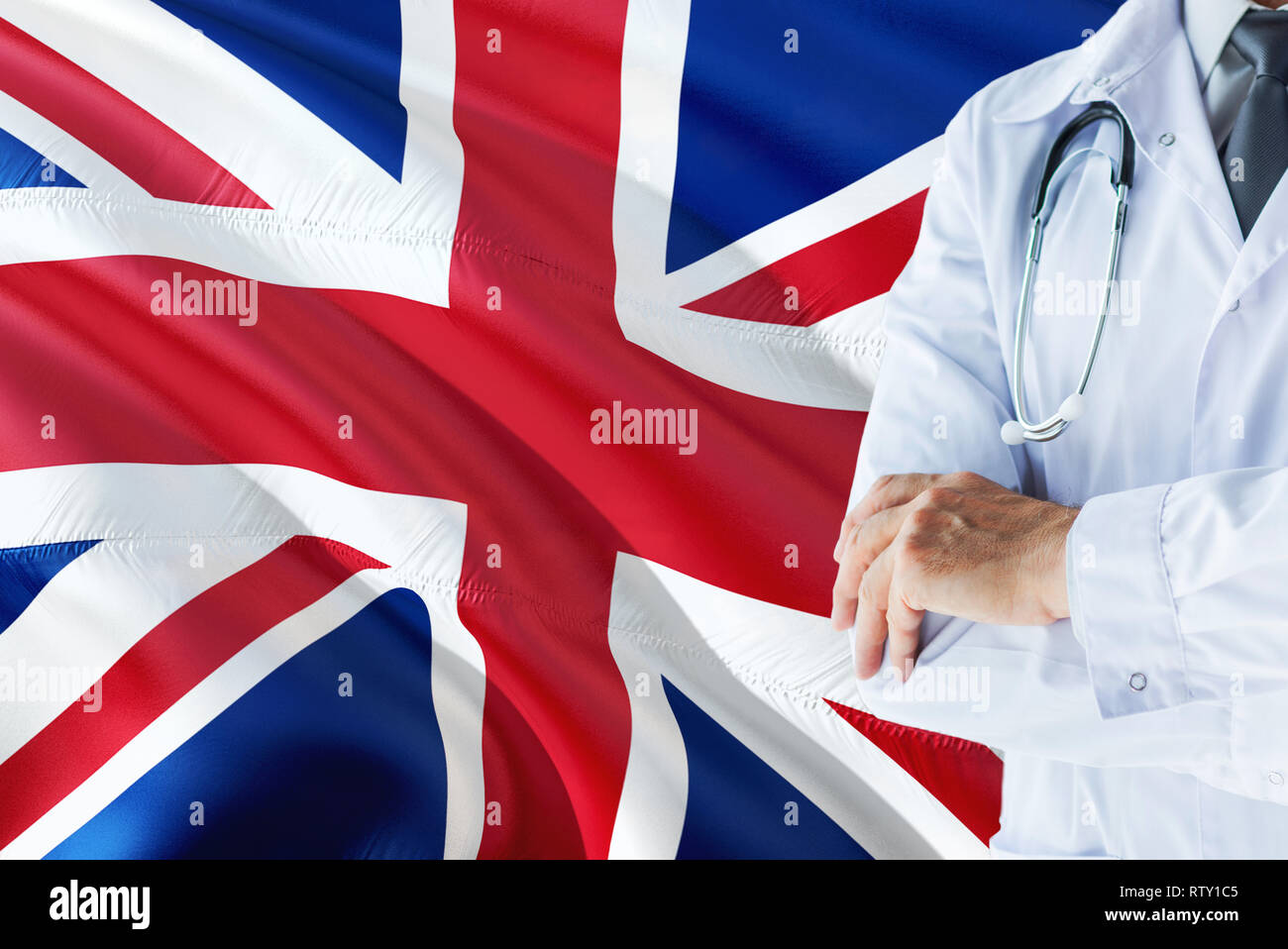 British Doctor standing with stethoscope on United Kingdom flag background.  National healthcare system concept, medical theme Stock Photo - Alamy