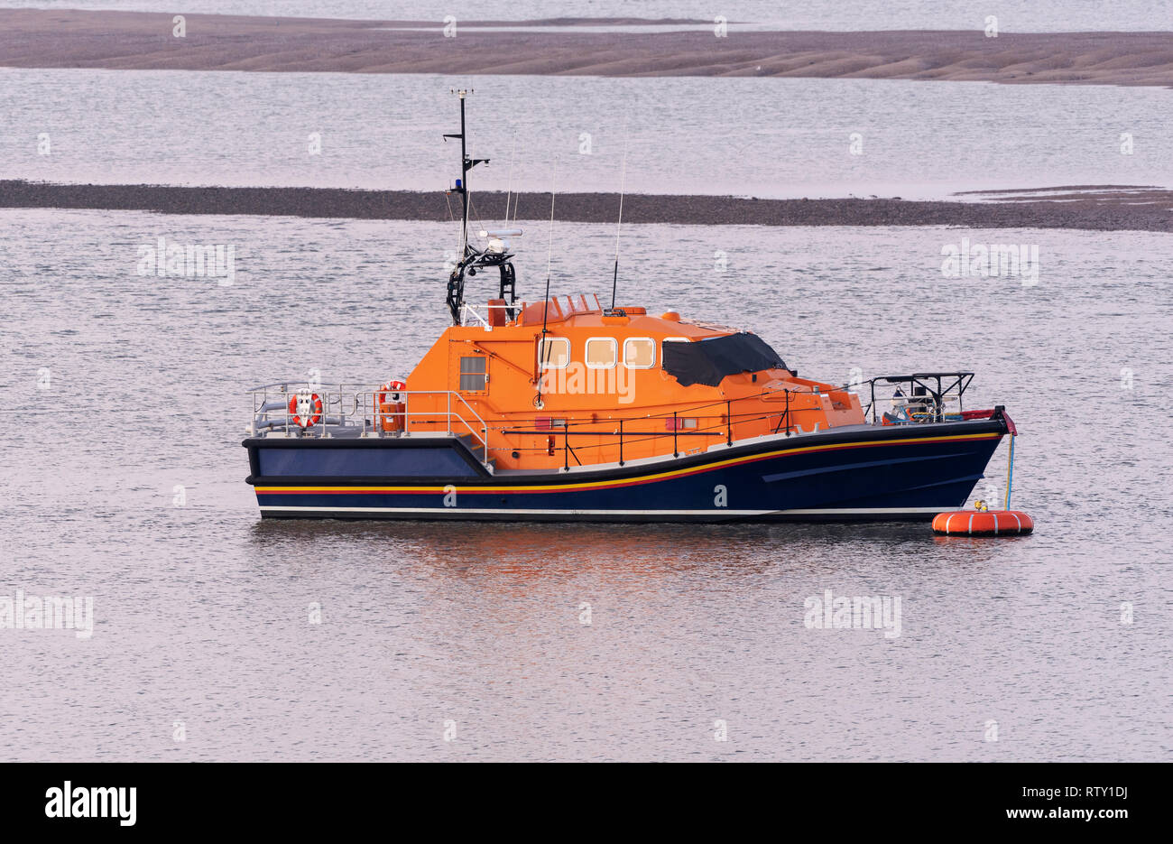River Torridge, Appledore, Devon UK. February 2019. A lifeboat on mooring mid River Torridge. Stock Photo