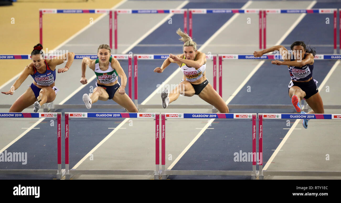 Germany's Cindy Roleder (second right) in action during the second semi-final of the Women's 60 metre hurdles during day three of the European Indoor Athletics Championships at the Emirates Arena, Glasgow. Stock Photo
