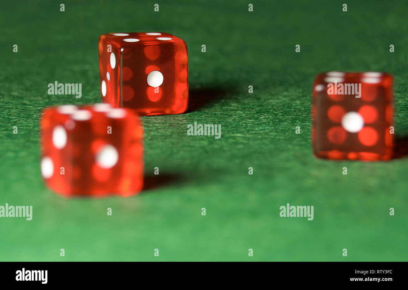 Casino dices on green cloth. The concept of online gambling. Stock Photo