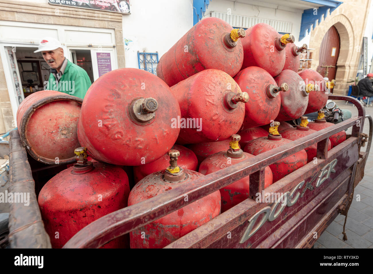 Gas cylinder delivery cart & deliveryman, Essaouira, Morocco Stock Photo