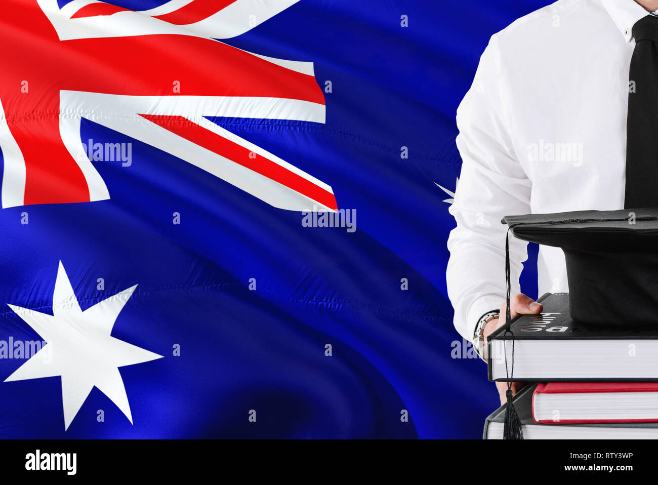 Successful Australian student education concept. Holding books and