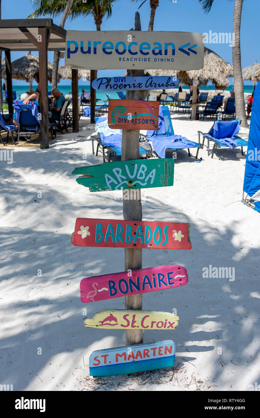 Driftwood island signs on Palm Beach, Noord District, Aruba, ABC Islands, Leeward Antilles, Caribbean Stock Photo