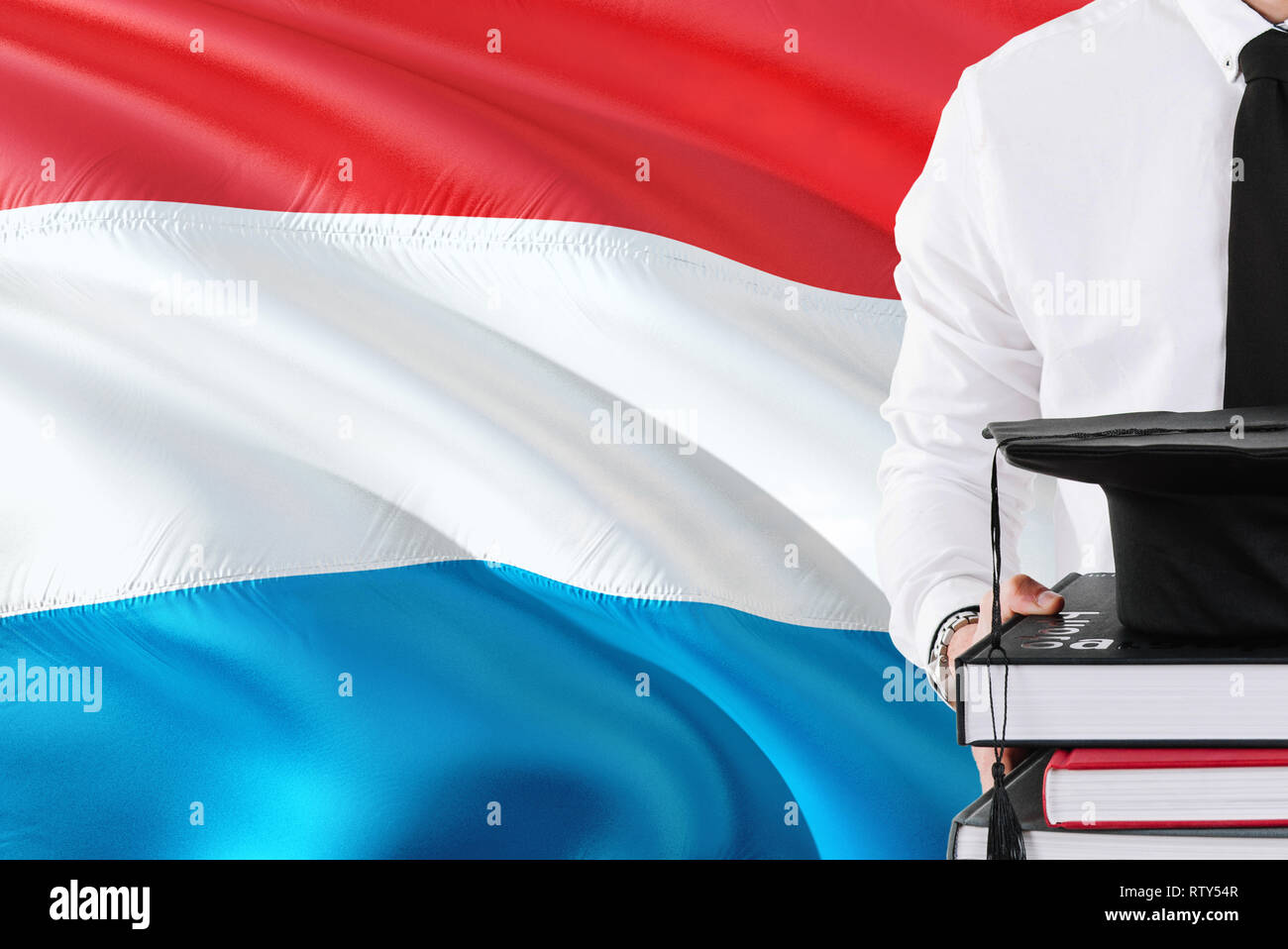 Successful Luxembourger student education concept. Holding books and