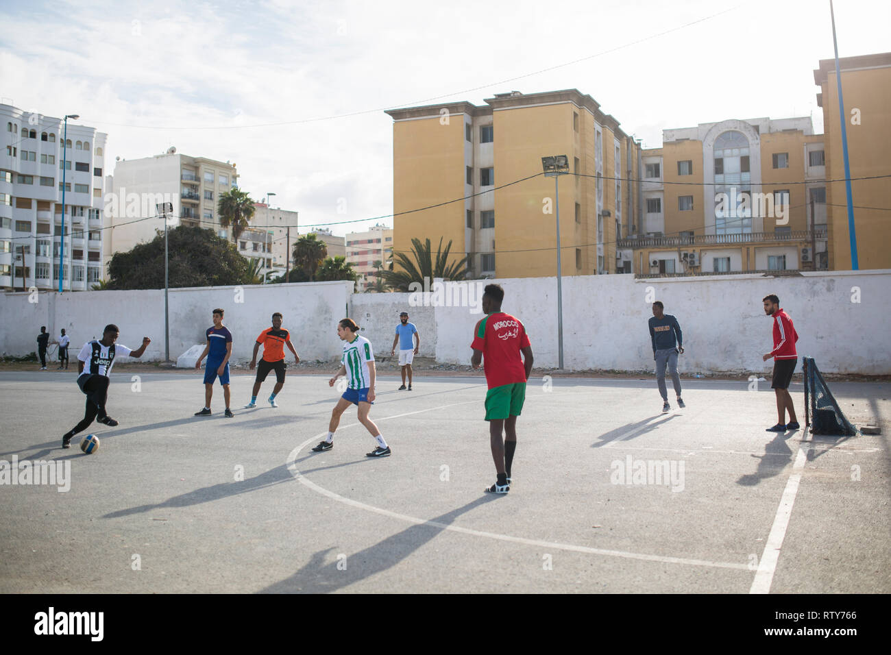 CASABLANCA, MOROCCO - MARCH 2, 2019:   A group of boys playing football  in Casablanca, Morocco. Stock Photo