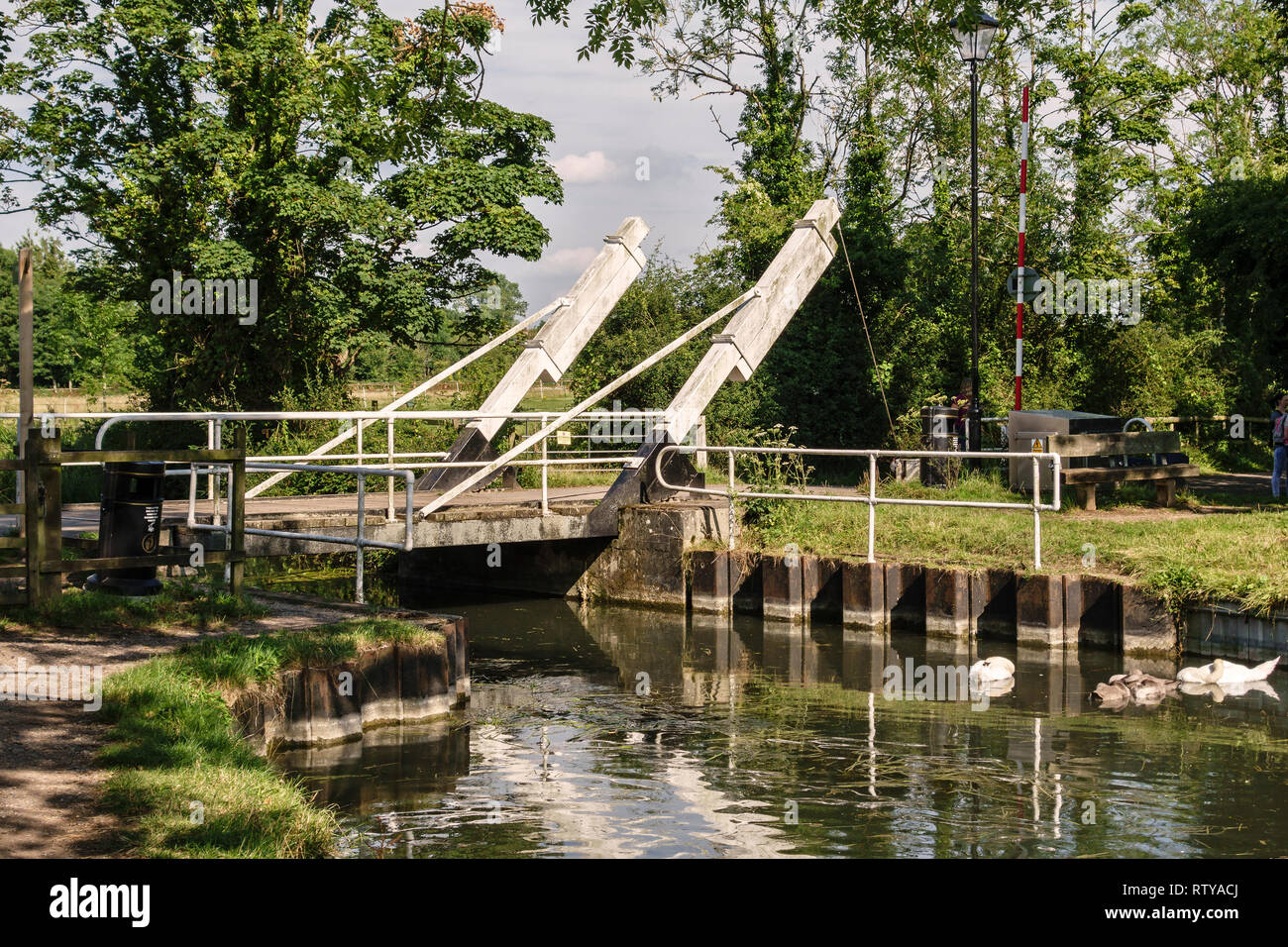 An opening  'bascule' bridge or drawbridge on the Basingstoke Canal near Odiham Castle, Hampshire, UK Stock Photo