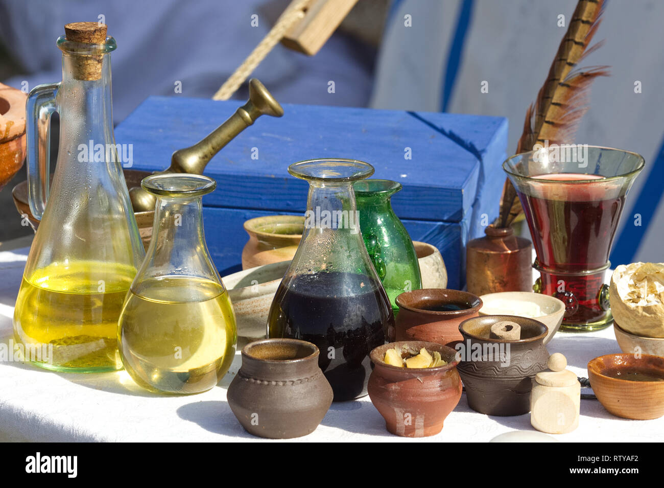 Table full of vinegar's, cooking oils and cooking wines in Medieval times Stock Photo