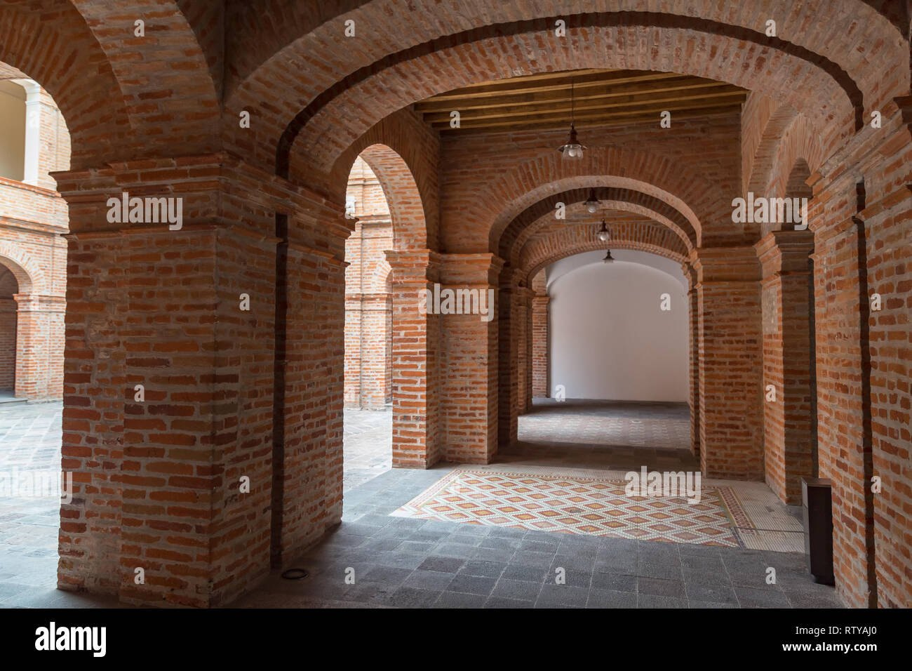 Quito, Ecuador, January 2019: Interiors of the Contemporary Art Center, exposed brick walls and arches, where works of contemporary artists are exhibi Stock Photo