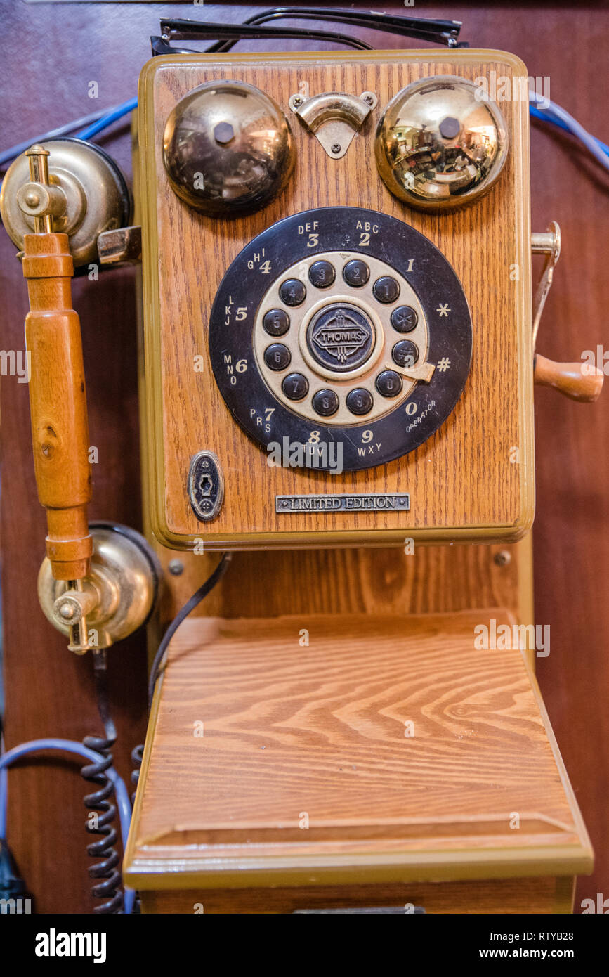 Functional vintage wall mounted telephone unit in good condition Stock